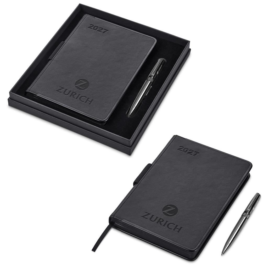 A black 2027 leather planner set by Zurich, shown both inside its open presentation box and closed on a white background, accompanied by a silver pen.
