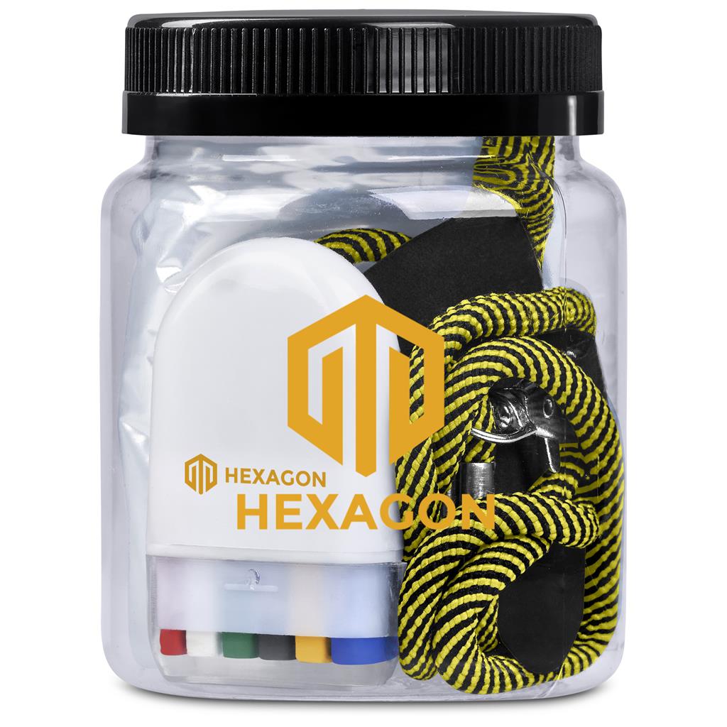 Clear container with black lid containing Hexagon branded earplugs and lanyards on a white background