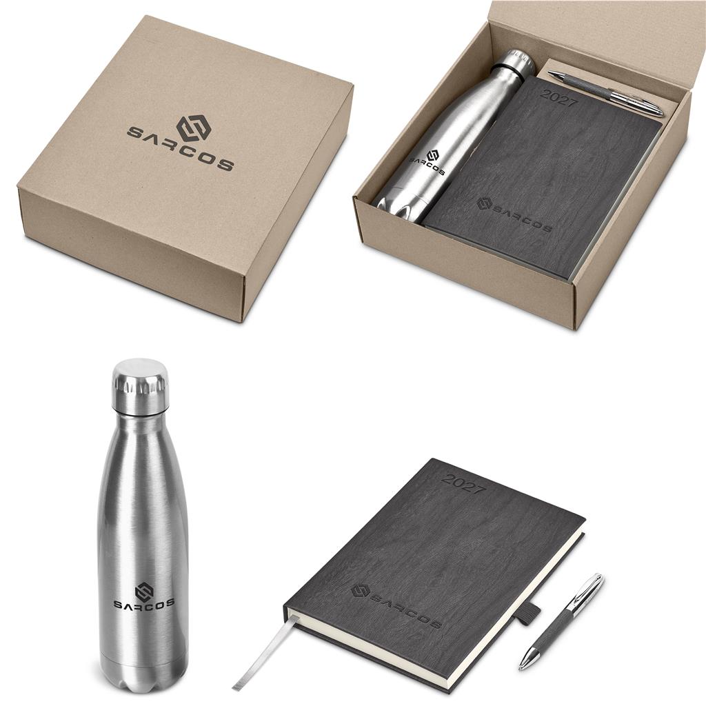 SARCOS branded gift set featuring a brushed silver stainless steel water bottle, a dark gray wood-grain notebook, a pen, and a kraft paper box on a white background.

