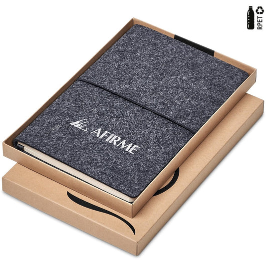 Dark gray notebook with 'AFIRME' branding in a cardboard box on a white background


