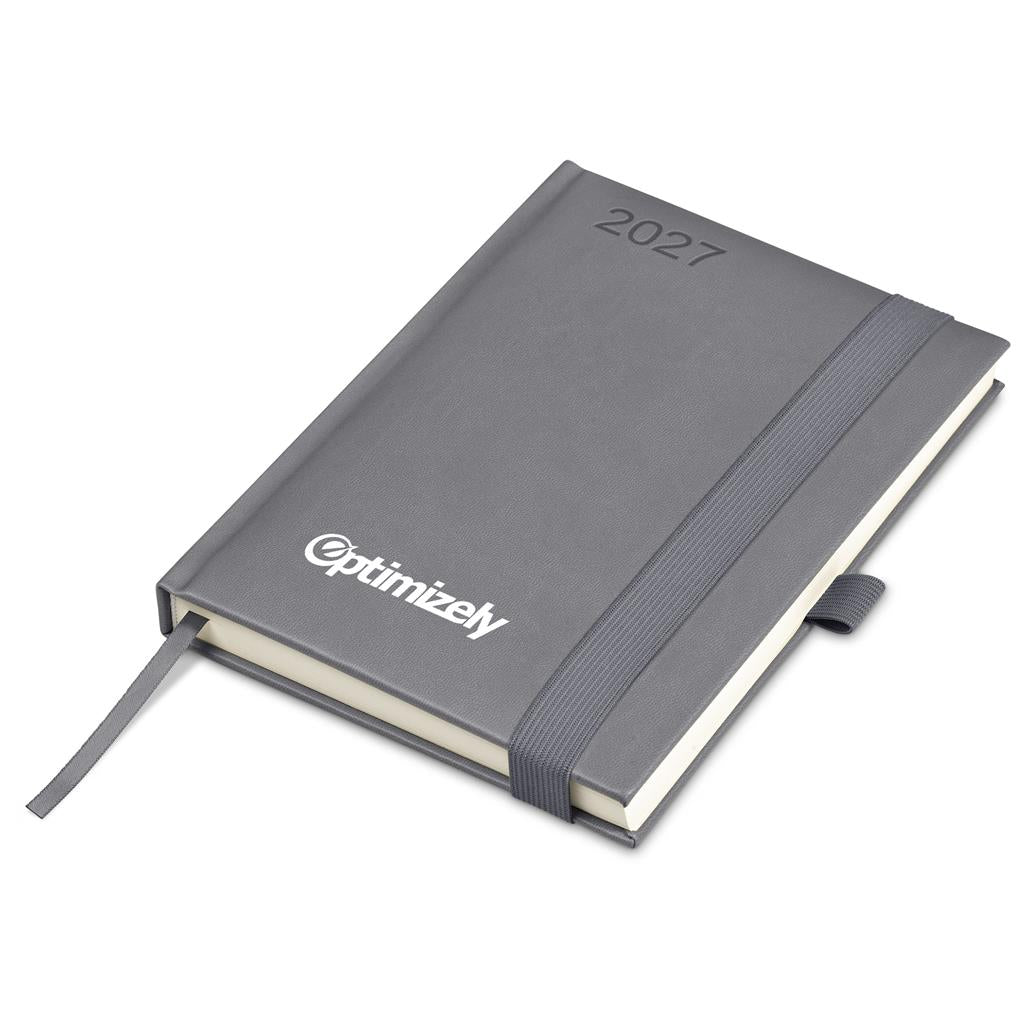 A 2027 daily planner by Optimizely in dark gray, featuring a textured cover, white logo, elastic closure band, and a ribbon bookmark, shown on a plain white background.


