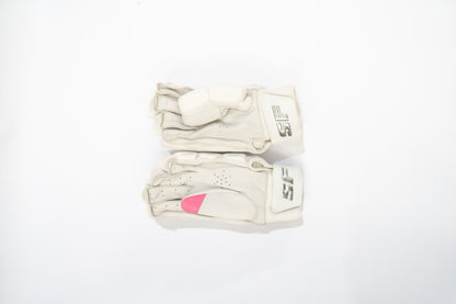White batting gloves with pink heart design on a white background

