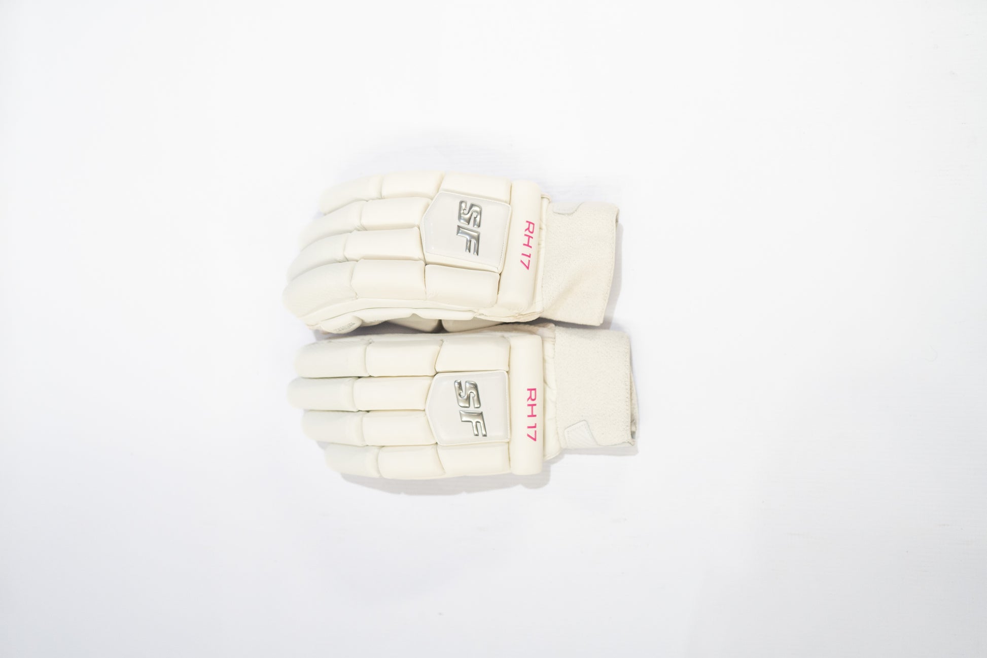 Pair of white cricket gloves with 'SR' branding on a white background

