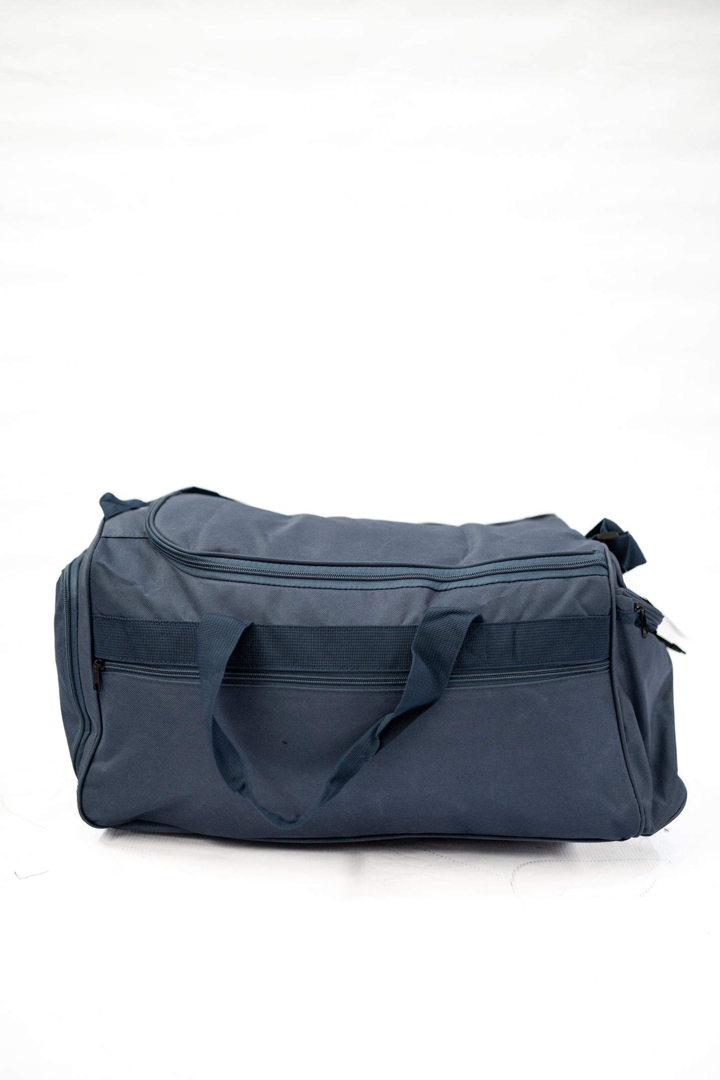 Blue duffel bag on a white background

