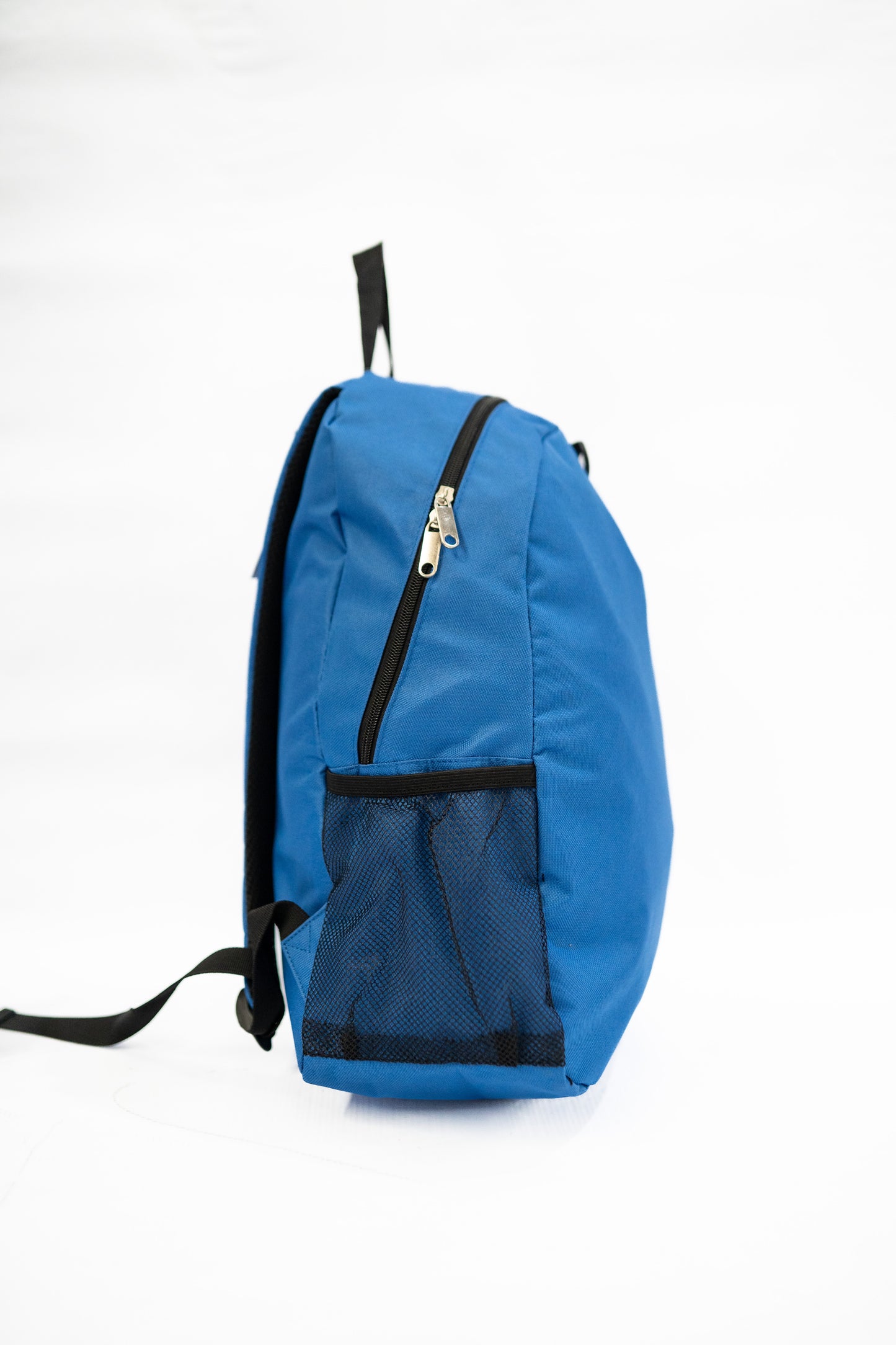 Blue backpack with black straps on a white background

