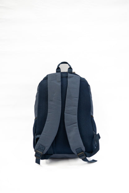 Back view of a blue backpack on a white background

