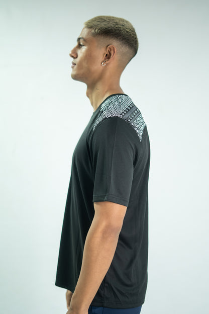Man wearing a black t-shirt with patterned shoulders against a white background

