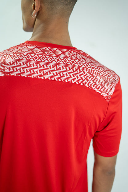 Red t-shirt with geometric pattern on a plain background

