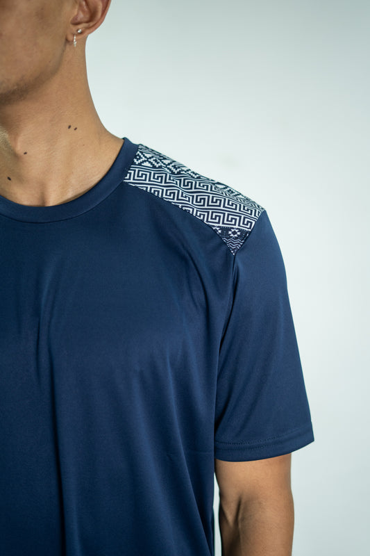 Navy blue t-shirt with geometric pattern on shoulder against a light gray background

