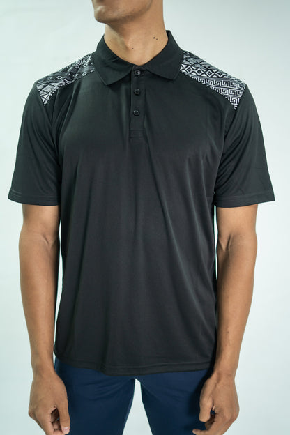 Black polo shirt with patterned shoulders worn by a person on a white background

