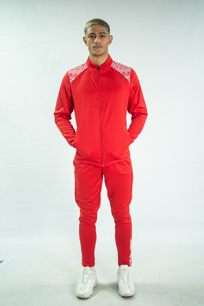 Person wearing a red tracksuit with white accents on a white background


