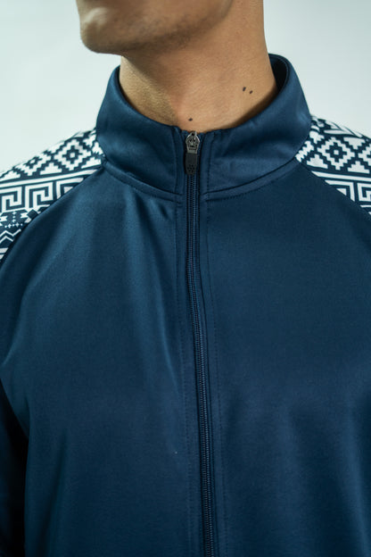 Navy blue jacket with a patterned sleeve on a neutral background

