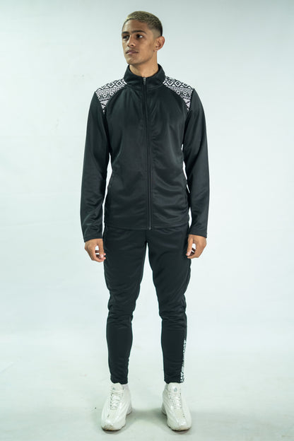 Person wearing a black tracksuit with white accents on a white background

