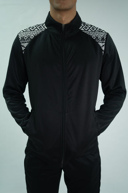 Black tracksuit with patterned shoulders on a gray background

