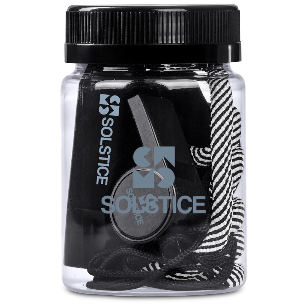 Jar of Solstice branded hair ties with black and zebra patterned ties.

