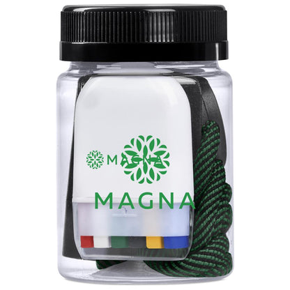 Clear container with black lid containing colorful items and a green rope, branded 'Magna'.

