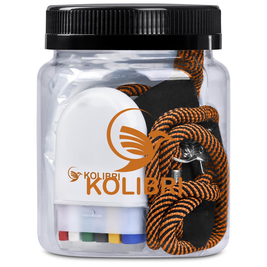 Clear container with black lid containing a white object and orange and black rope, branded 'Kolibri'.

