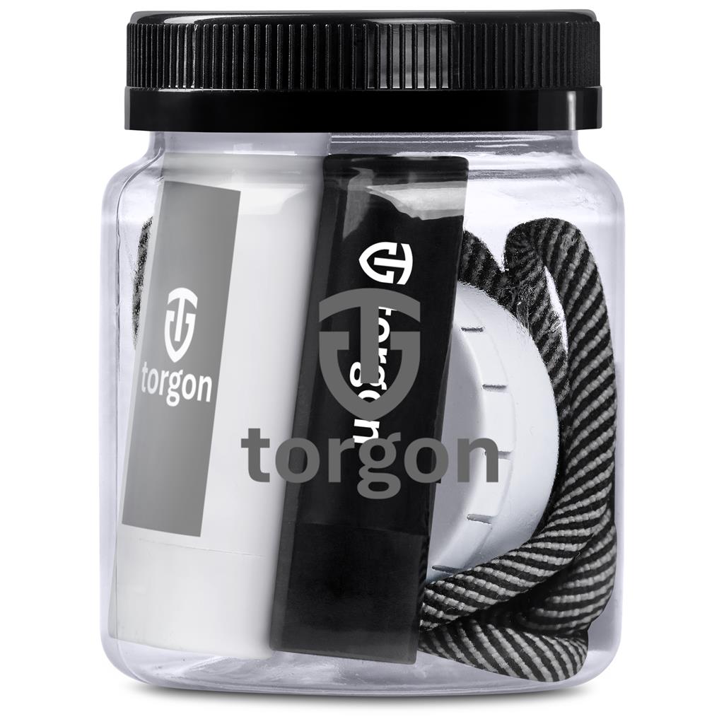 Clear container with black lid containing hair ties and a hair ball, branded 'torgon'.

