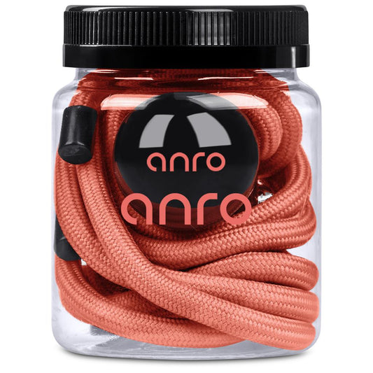 Jar of coral-colored shoelaces with 'anra' branding on a white background

