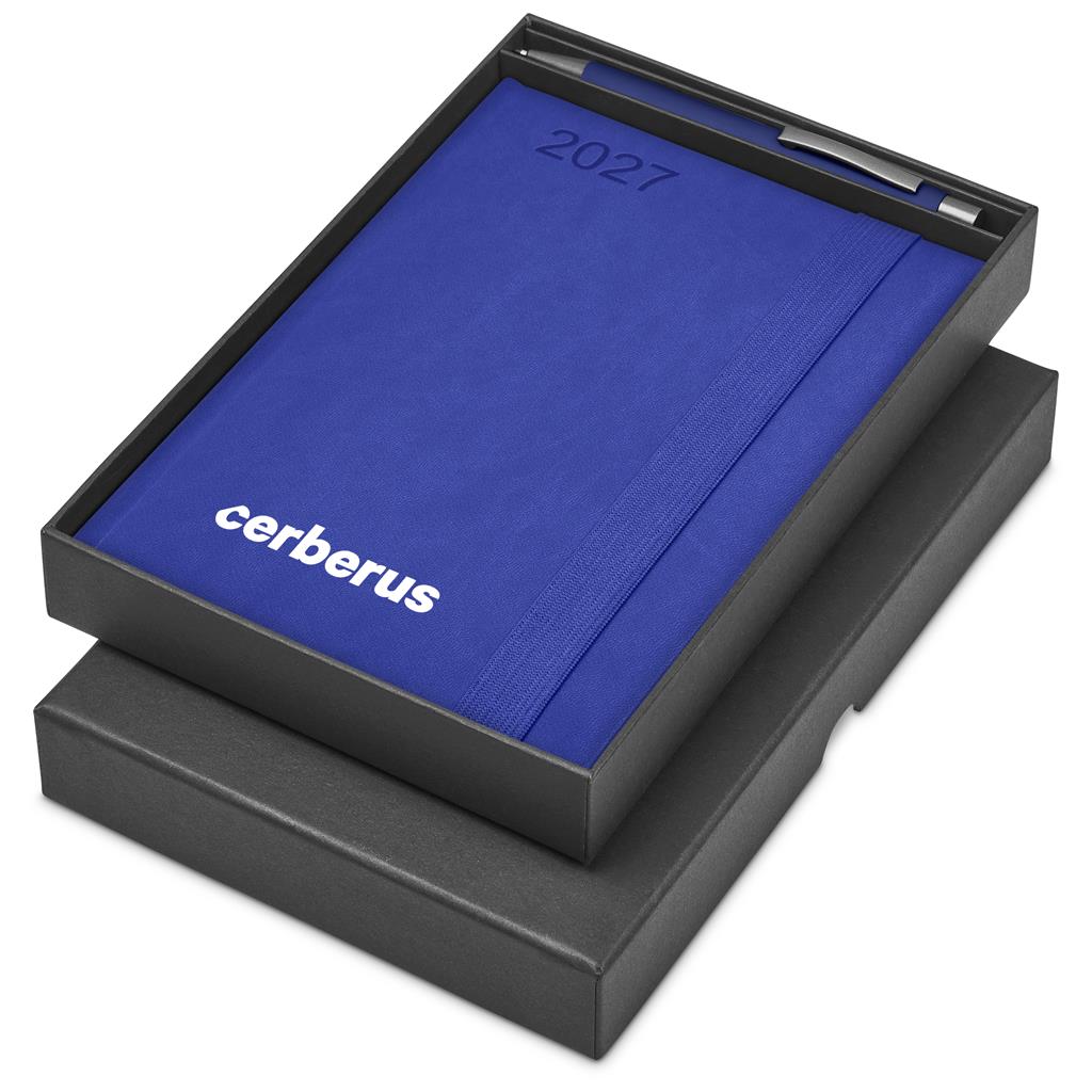 A blue 2027 daily planner with the brand name 'cerberus' printed in white, presented in an open black gift box with a pen inside, on a white background.

