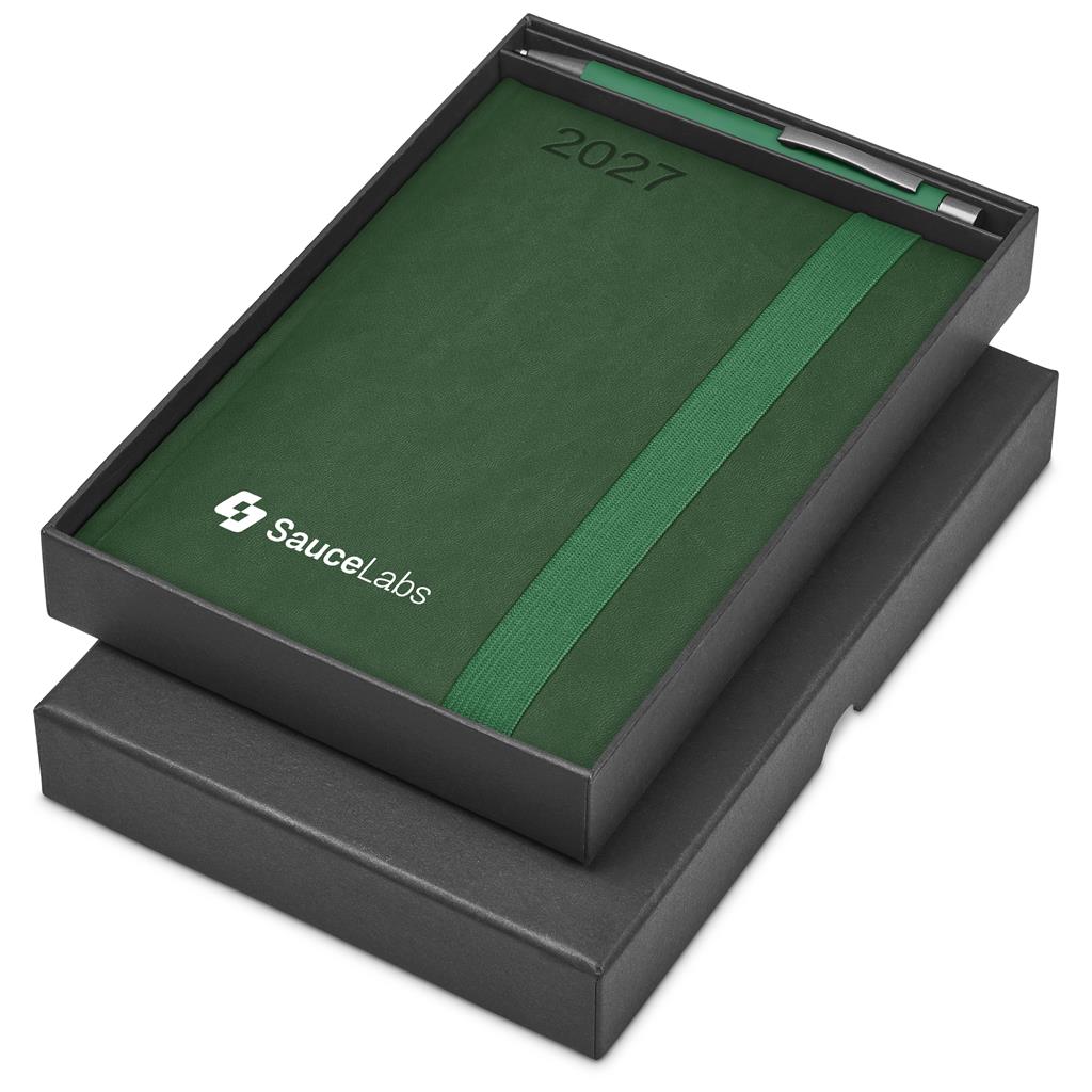 A 2027 daily planner by SauceLabs in dark green textured paper with a green elastic band, presented in a black box with its lid off, on a white background.

