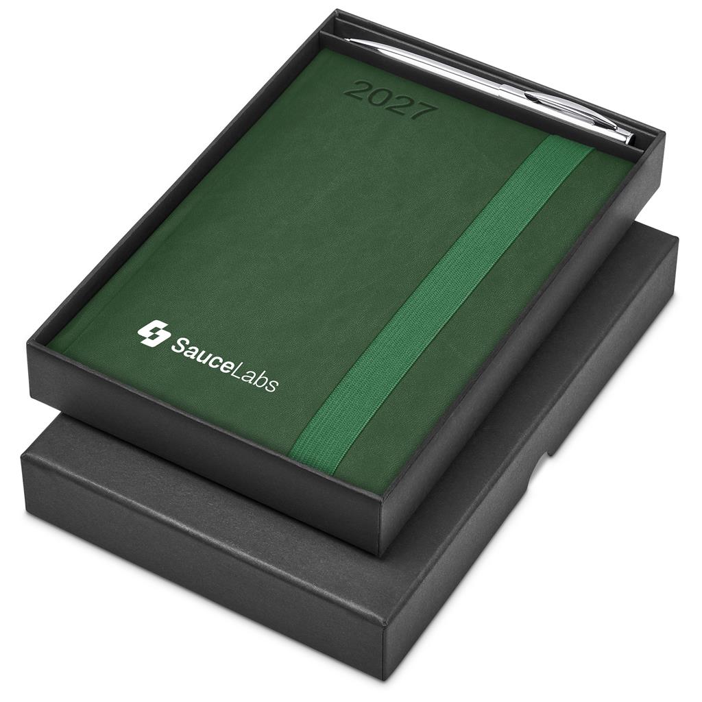 A 2027 Succulent Calendar by SauceLabs in a black presentation box, featuring a textured dark green cover with a vertical green stripe, the year '2027' embossed near the top, and the SauceLabs logo printed in white. A silver pen is tucked into the top slot.

