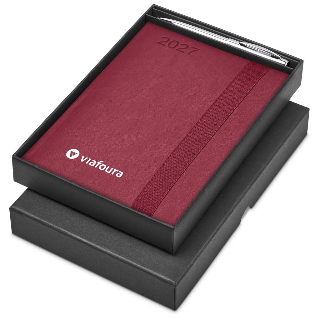 A 2027 ViaFoura calendar in deep burgundy with a silver pen, presented in a black gift box on a white background.


