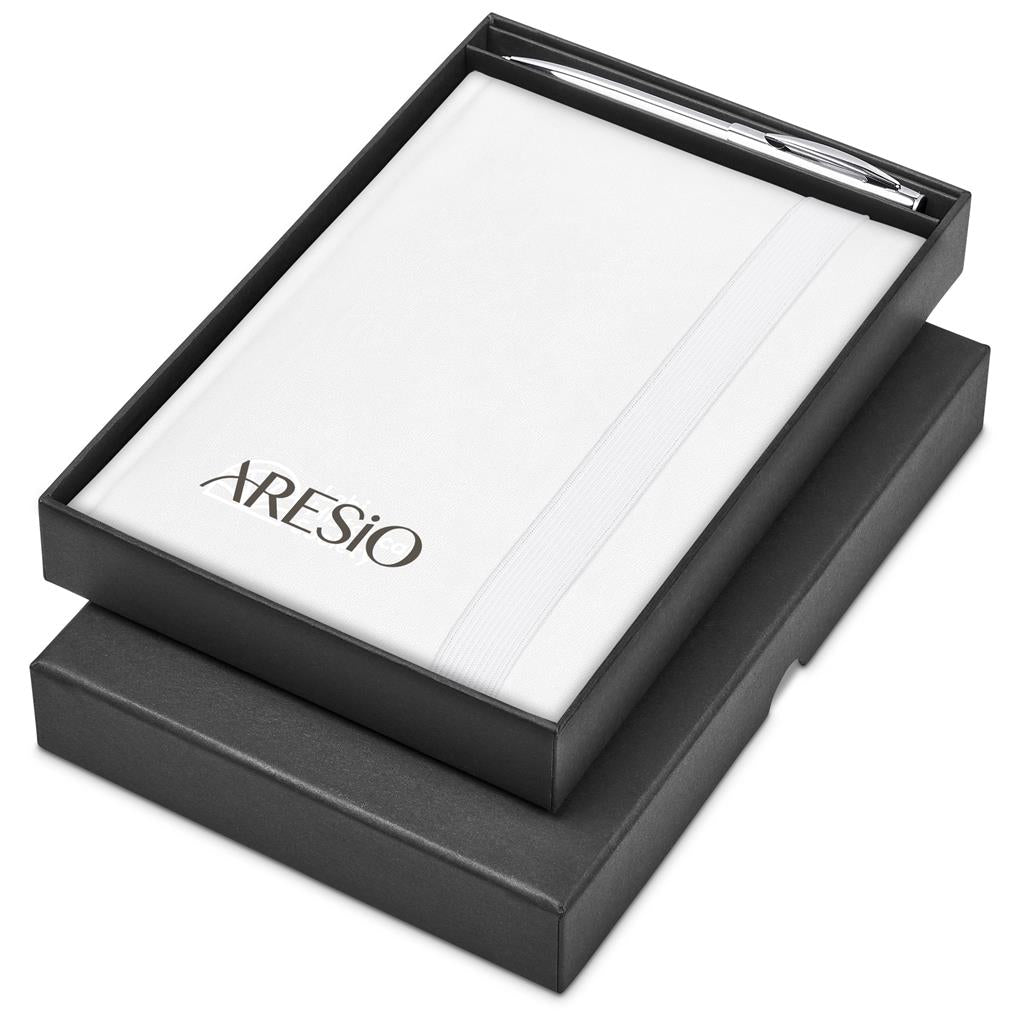 A white 2027 daily planner with the brand name 'DEXONS' printed in black, presented in an open black box with a matching black pen, on a white background.

