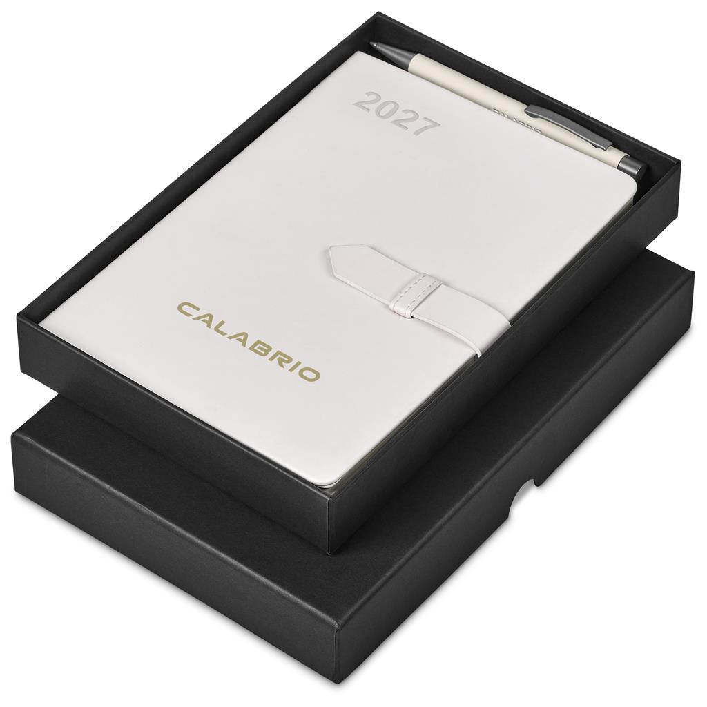 A 2027 pocket calendar with a white leather strap closure, presented in a black gift box with a matching pen.

