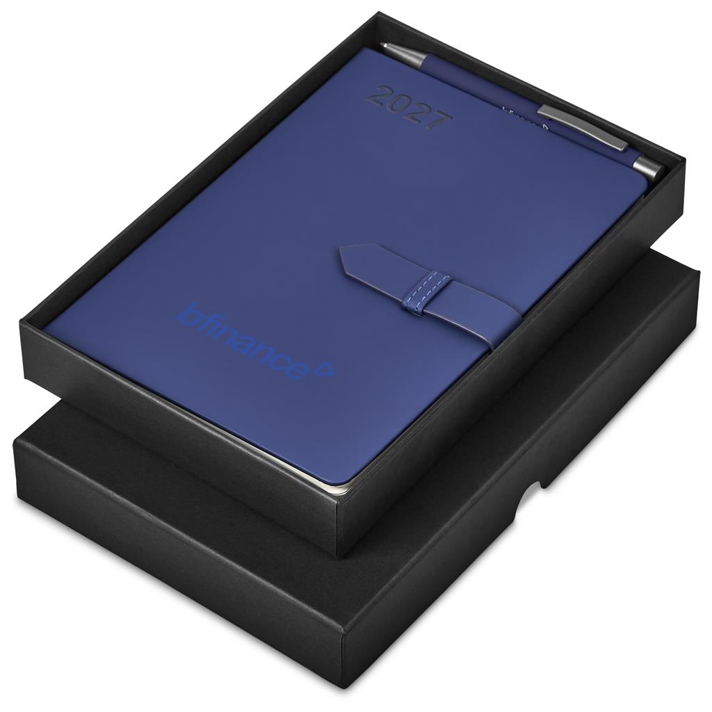 A blue 2027 leather-bound planner or notebook presented in an open black gift box, with a matching blue pen visible at the top and embossed branding on the cover.

