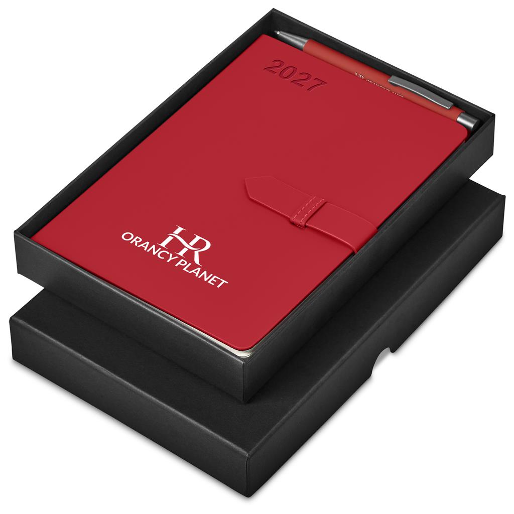 A red 2027 leather-bound notebook with a pen in a black presentation box. The notebook features a white printed logo for 'ORANCY PLANET' and 'HR' monogram, with '2027' printed in black near the top.

