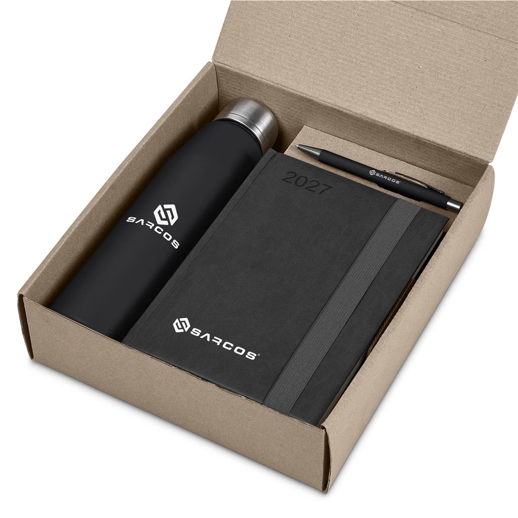 A Barcos branded gift set in a kraft paper box, featuring a black insulated bottle, a black 2027 notebook, and a black pen.

