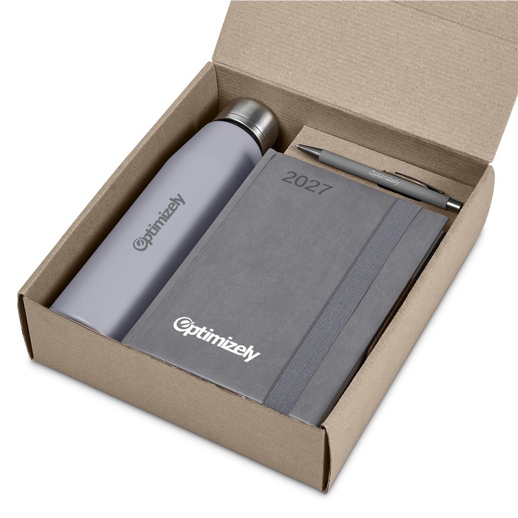 An Optimizely gift set in a brown cardboard box, featuring a matte gray insulated bottle, a matching gray 2027 planner, and a gray pen.


