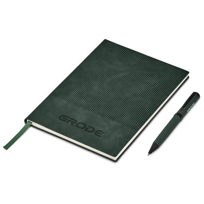 Green notebook with pen on a white background

