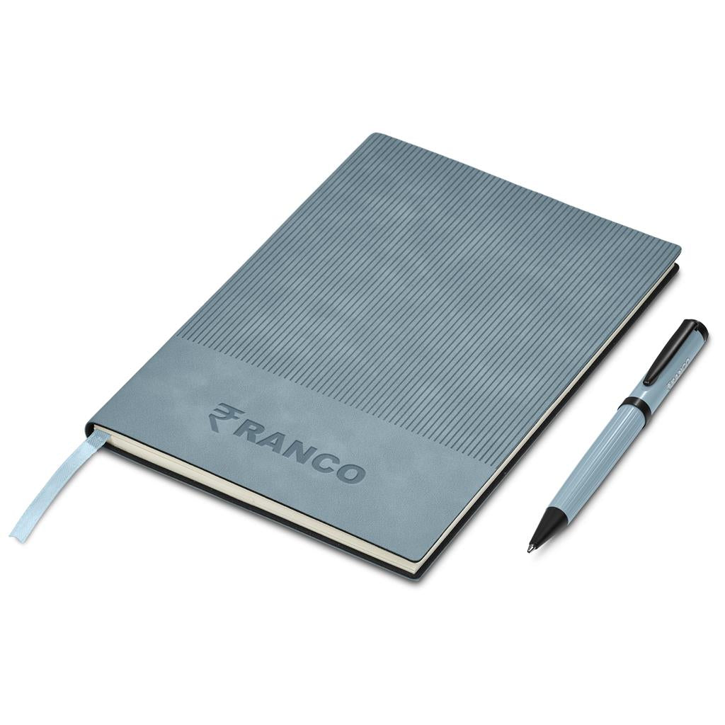 Gray notebook with pen on a white background, featuring the Ranco brand.

