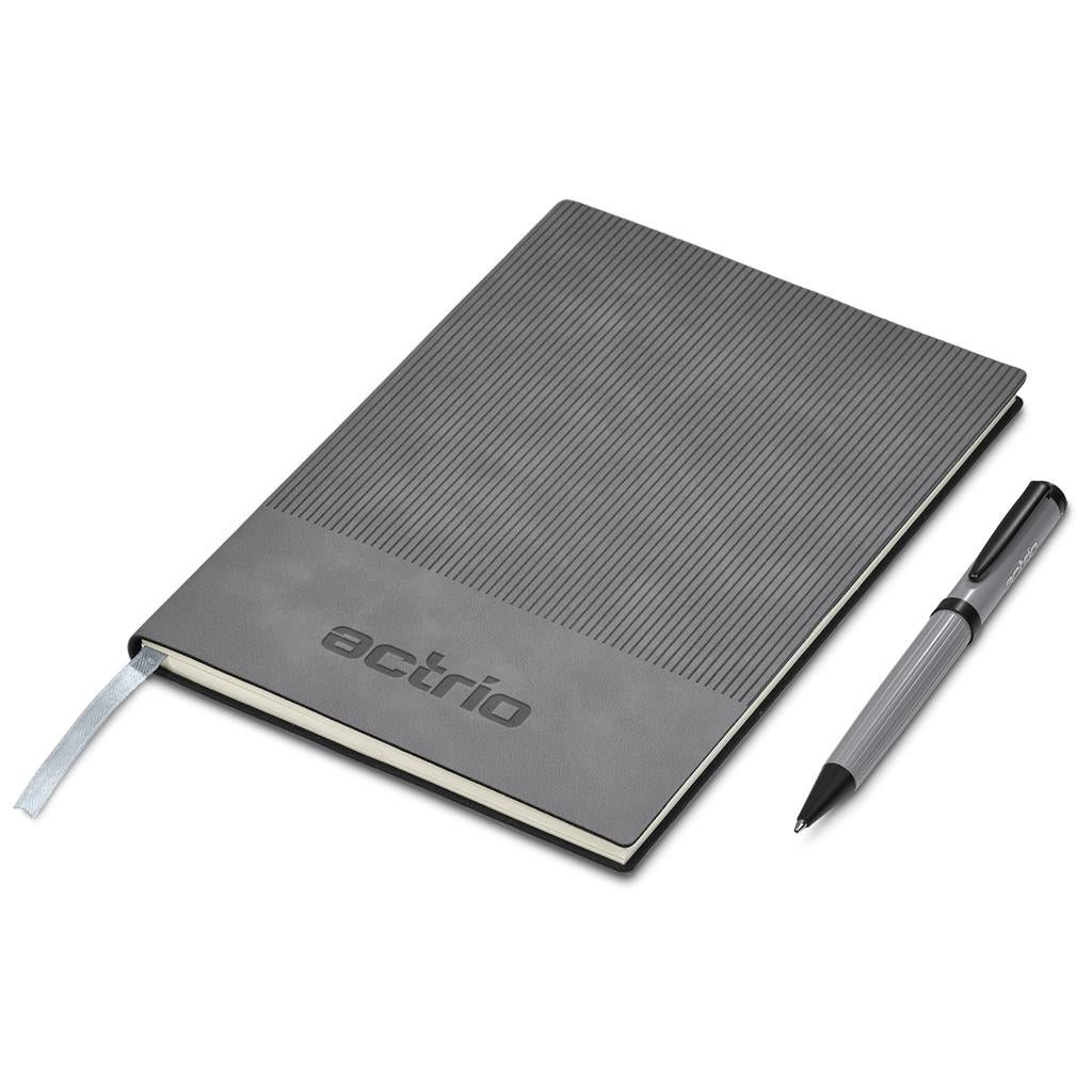 Gray notebook with a pen on a white background

