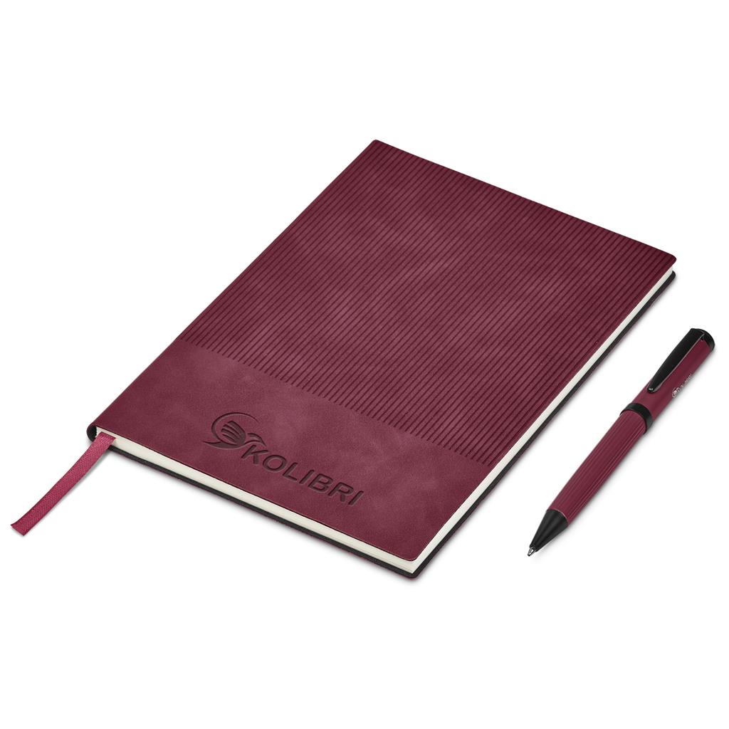 Maroon notebook with pen on a white background

