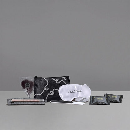 Collection of travel items including a pouch, eye mask, and other products on a gray background with 'FALCONX' branding.

