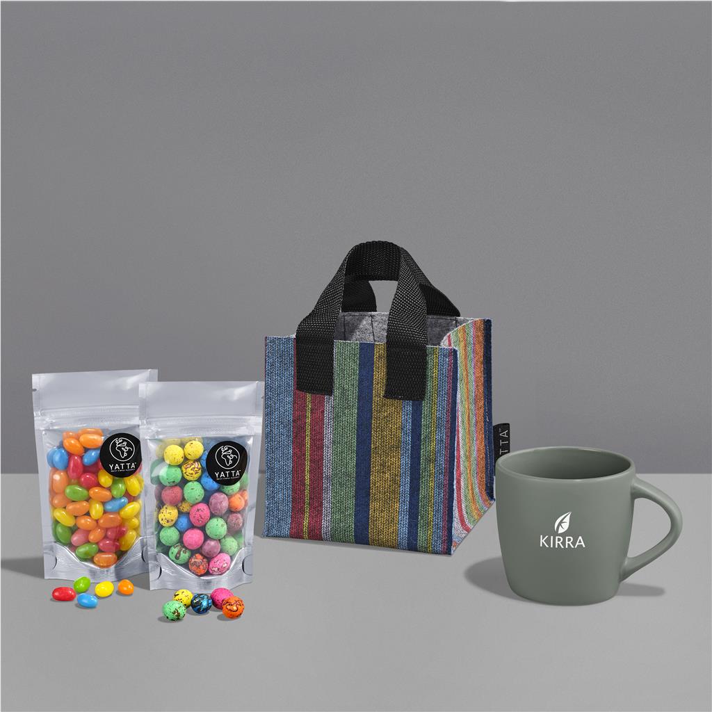 Colorful candies in bags, a striped gift bag, and a green mug with 'KIRRA' branding on a gray background.


