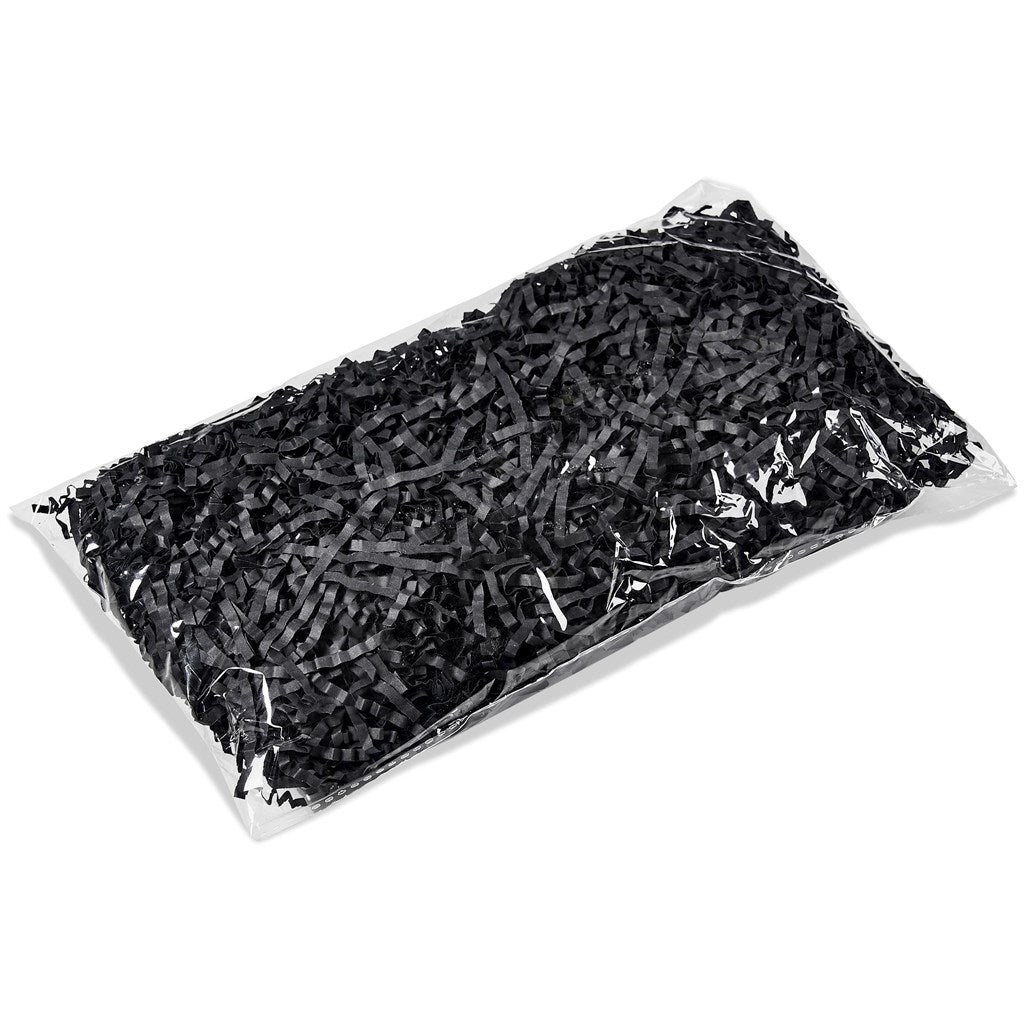 Clear plastic bag filled with black rubber bands on a white background

