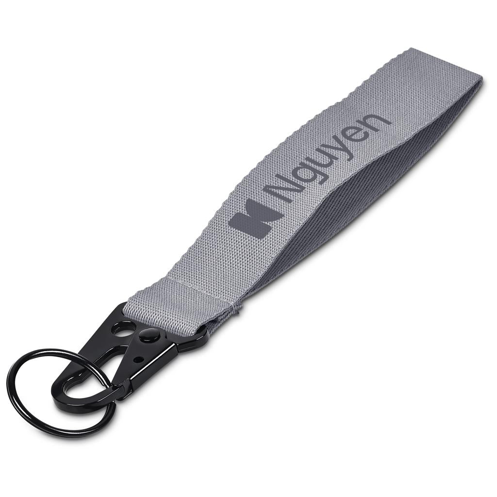 Gray lanyard with a key ring and 'Nguyen' branding on a white background

