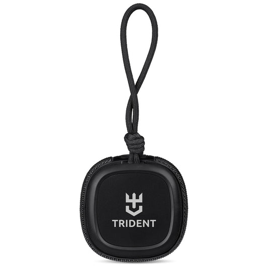 A black round keychain or bag charm with a black loop strap, featuring the white Trident logo and brand name on the front, set against a plain white background.

