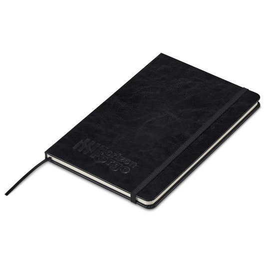 A black textured hardcover notebook with an elastic closure band and a matching ribbon bookmark, featuring the debossed brand name 'NIPPON NOZUKU' on the cover, shown on a plain white background.

