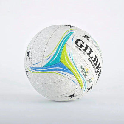 A white leather sports ball with colorful blue, green, and yellow wave patterns and the brand name 'GILBERT' printed on it, set against a plain light gray background.

